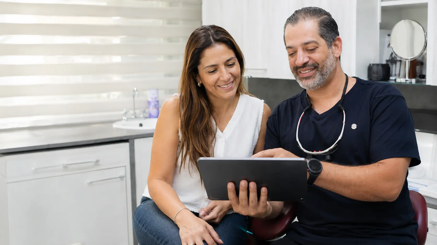 Dr. Collado in consultation with a patient